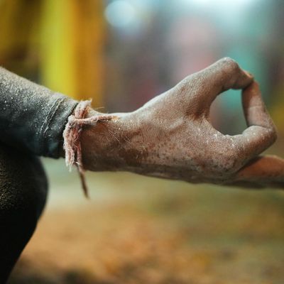 Close-up detail of hands in a specific yoga mudra.